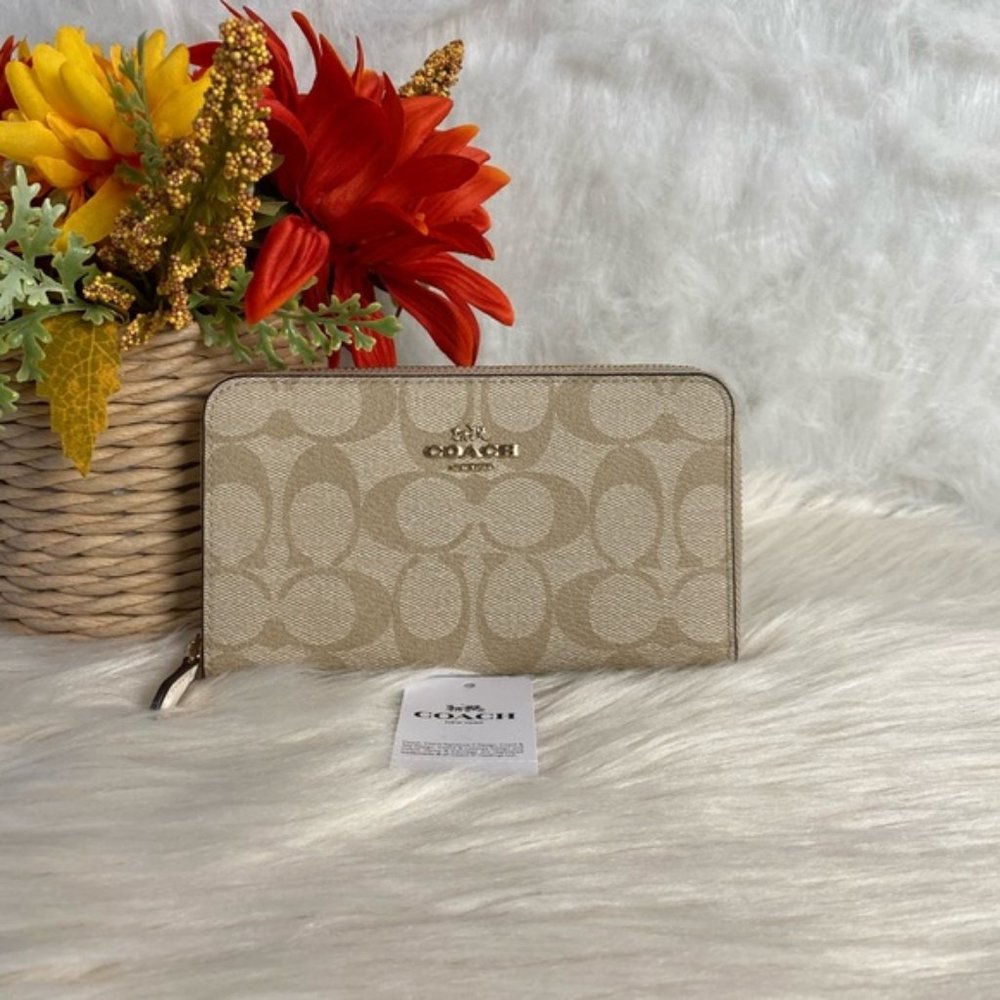 COACH MEDIUM ZIP AROUND WALLET IN SIGNATURE CANVAS